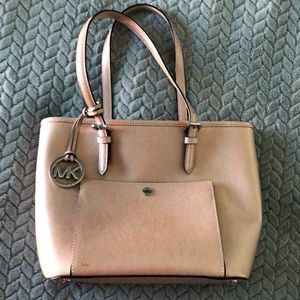 Michael Kors shiny pink purse- no stains in the inside lining - non- smoker